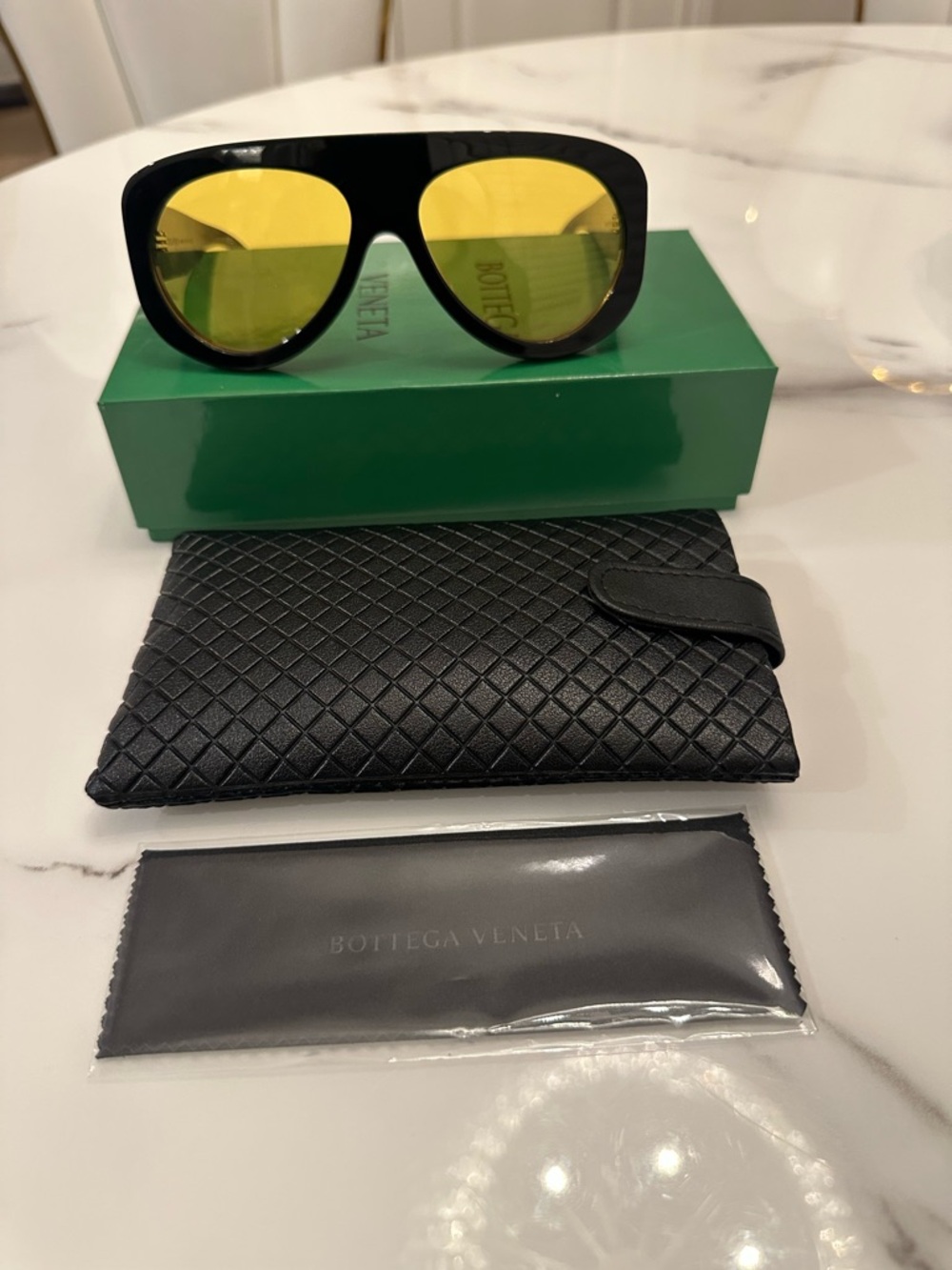 Bottega Veneta Black Frame Sunglasses with Yellow Lenses